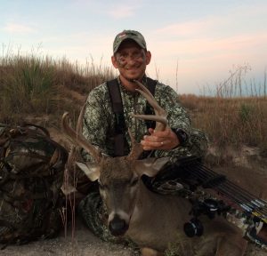 Bowhunting World Publisher Jared Pfeifer with his buck